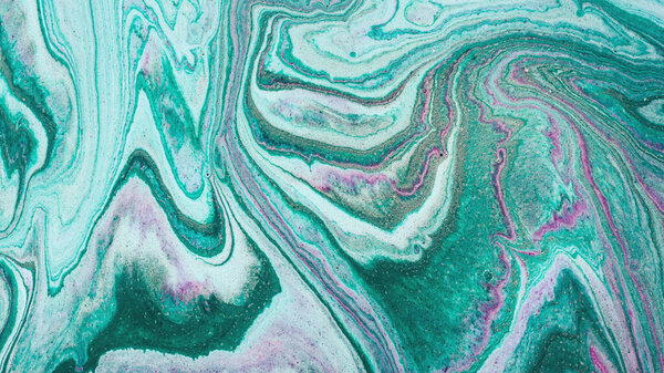 Closeup of mixed turquoise and purple abstract marble texture. Hand painted beautiful pattern, wallpaper or background for print design as invitation or greeting cards. Ocean or sea artwork