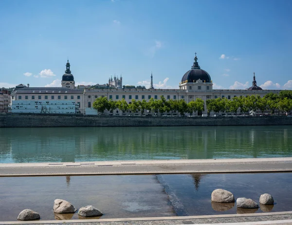 View of Rhone river with Grand Hotel Dieu after 2018 renovation and Fourviere cathedral in Lyon city France