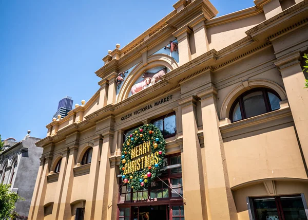 Main entrance and facade of the Queen Victoria Market with christmas garland in Melbourne Victoria Australia