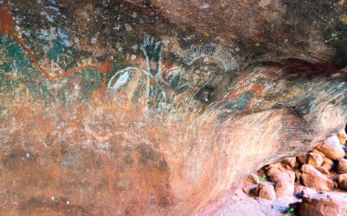 Aboriginal cave painting inside the family cave or kulpi mutitju clipart