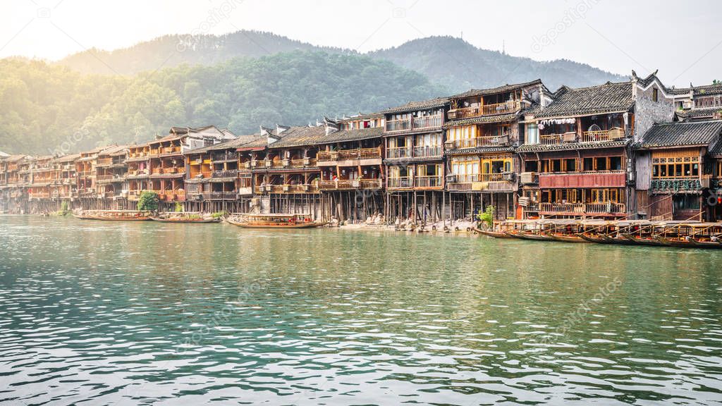Old Chinese houses on riverside in Fenghuang ancient town Hunan 