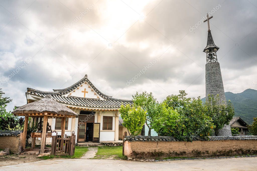 Korean style church and cross in historic Hahoe folk village wit