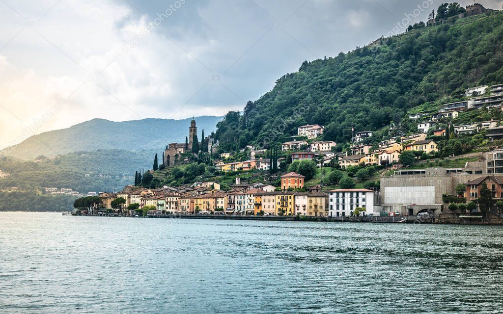 Morcote lakeside village scenic townscape view taken from Lake Lugano and dramatic light in Morcote Ticino Switzerland