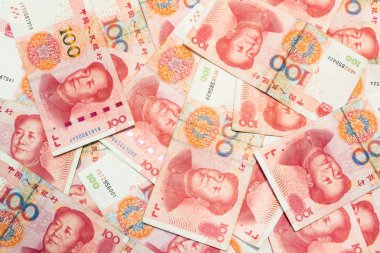 Birçok yüz Çin yuan banknotlar, arka plan olarak Çin para birimi.