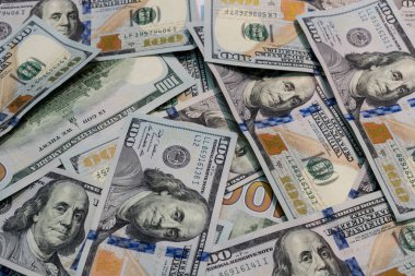 Yüz dolarlık banknotlar tablo arka planı olarak bir sürü.