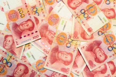 Birçok yüz Çin yuan banknotlar, arka plan olarak Çin para birimi.