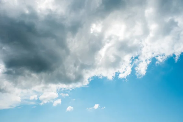 Gray clouds over blue sky, Clouds seeding to make rain clouds in afternoon.