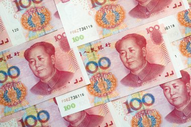 Stack of one hundred Chinese yuan bills as money background. Currency of China. clipart