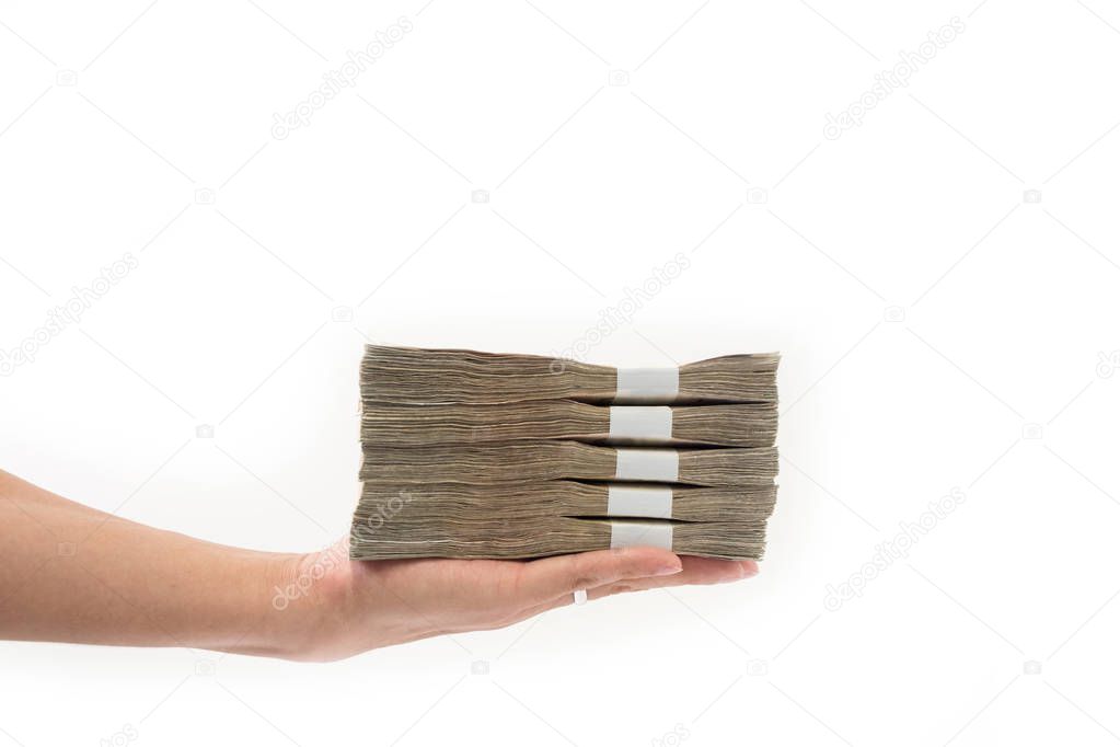 Hand holding stack of many Thai money, Hand giving Thai money on white background, Use for money or financial concept.