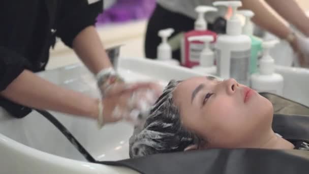Happy Young Asian Woman Hairdresser Applying Shampoo Massaging Hair Beauty  — Stock Video © cherayut000 #246680542