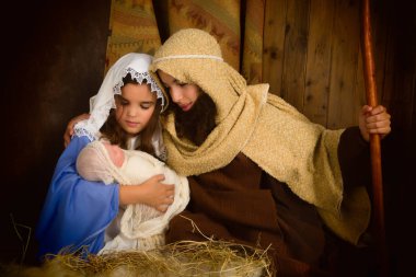 çocuk ve bebek reenacted Noel doğum sahnesi