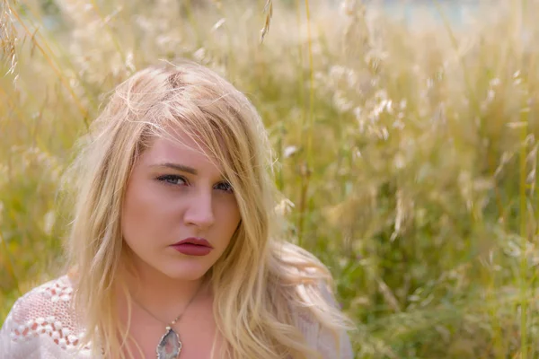 Young blonde woman closeup in nature — Stok fotoğraf