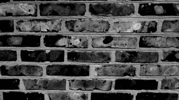 Abstract old black brick wall background. Dark wall texture