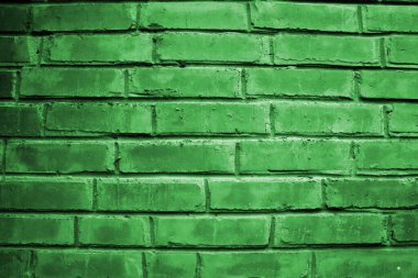 Soyut yeşil çizilmiş duvar yüzeyi. Güzel tuğla duvar dokusu