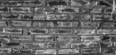 Soyut siyah eski çizilmiş tuğla duvar arka planı. Güzel koyu duvar yüzeyi