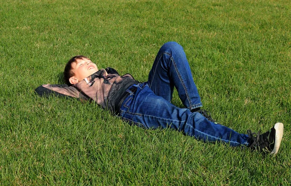 Joyful Teenage Boy Relaxing Green Grass Park Sunny Autumn Day — Stock Photo, Image