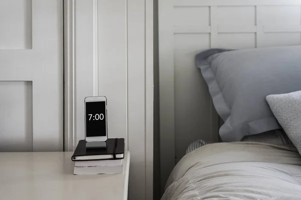 bedside table phone as alarm
