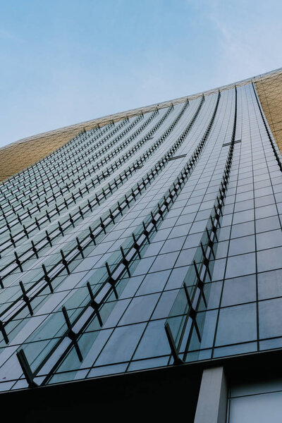 Looking up at generic glass building