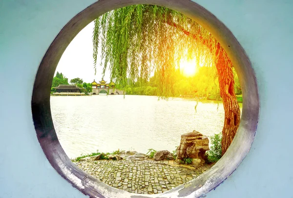 ive Pavilion Bridge (Also known as lotus Bridge) on the Lender west lake. The Chinese texts on the bridge meaning are lotus bridge.Slender west lake is a well-known scenic spot in China.