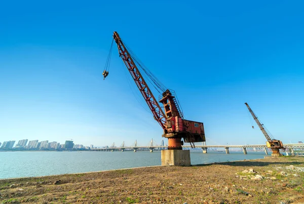 Crane on the waterfront pier — Stock Photo, Image