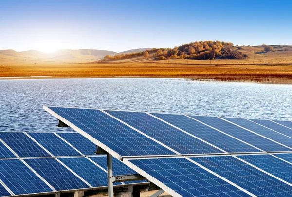 Photovoltaic power generation on the grassland river — Stock Photo, Image