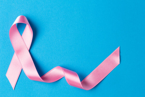 Pink ribbon on a blue background.Breast cancer.