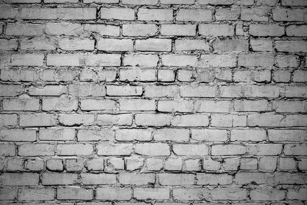 old brick wall. Black and white photo with vignetting effect