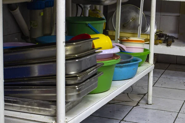 utility dishes washed in the dishwasher area, in the kitchen of the restaurant