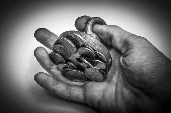 search magnet with found money and coins on isolated white background