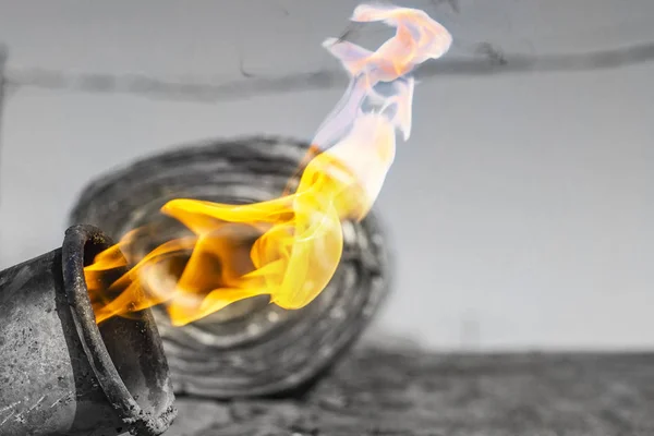 Gas burner with fire and roll of roofing material on blurred bac — Stock Photo, Image