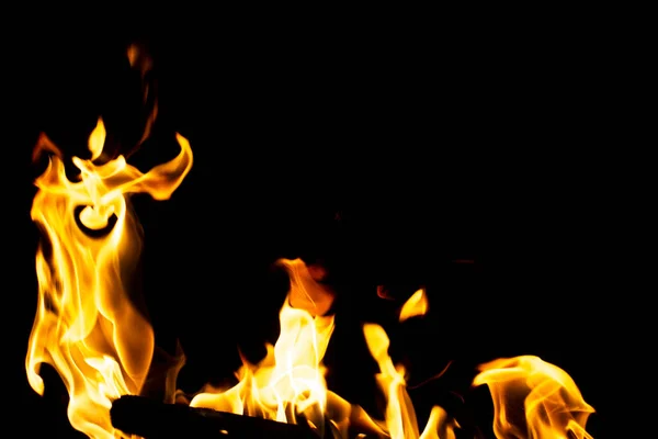 bright fire of barbecue on a black background