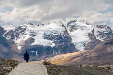 Hiker in Pastoruri glacier, Huascaran National Park, Peru clipart