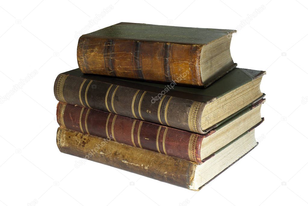 A stack of four ancient books isolate