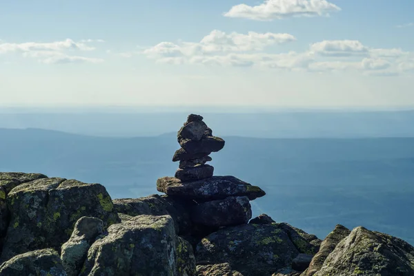 stone pyramid - a road sign on the mountain pass, reminiscent of a primitive sculptur