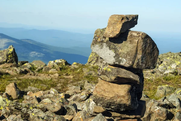 stone pyramid - a road sign on the mountain pass, reminiscent of a primitive sculptur