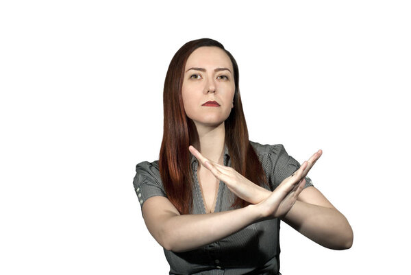 woman on a white background crossed her arms in a forbidding gesture