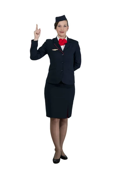 Stewardess Full Growth White Background Stands Shows Index Finger — Stock Photo, Image