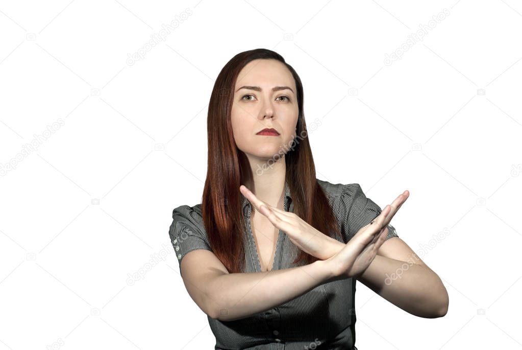 woman on a white background crossed her arms in a forbidding gesture