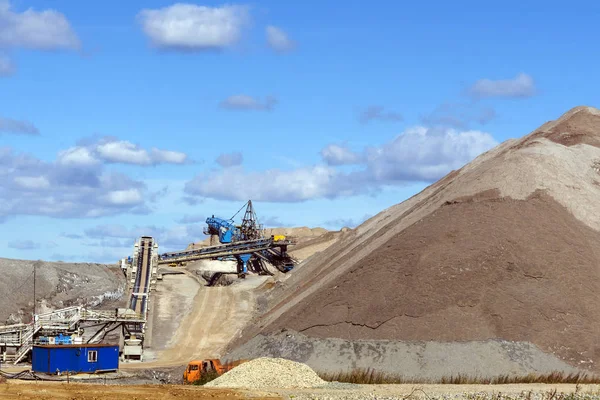 dumps of mined rock with a system of belt conveyors and spreaders, general view
