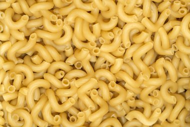 arka plan - packagin olmadan kilo hafif sarı kuru makarna yığını