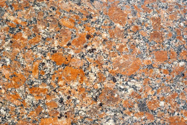 テクスチャ オレンジの飛散と磨かれた花崗岩スラブの多彩な表面 — ストック写真