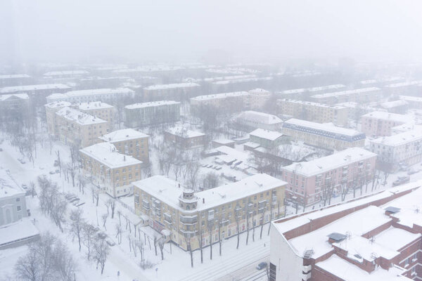 PERM, RUSSIA - MARCH 02, 2018: city blocks during a snowfall, bird's eye view