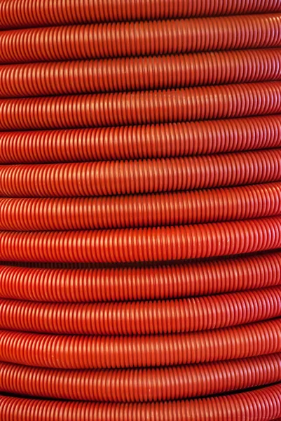 Vertikaler Hintergrund Rote Gewellte Flexible Polymerrohre Nahaufnahme — Stockfoto