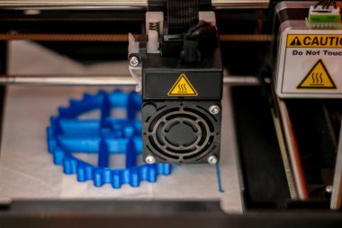 3D printer printhead while printing detail close-up clipart