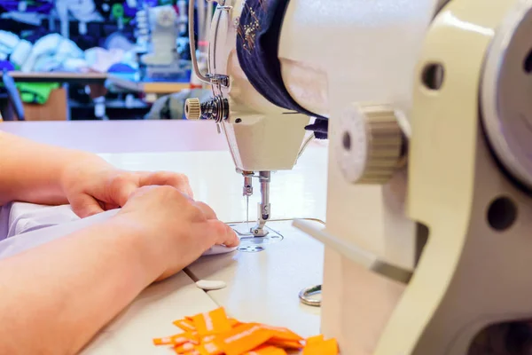 Industrial overlock sewing machine in work — Stock Photo, Image