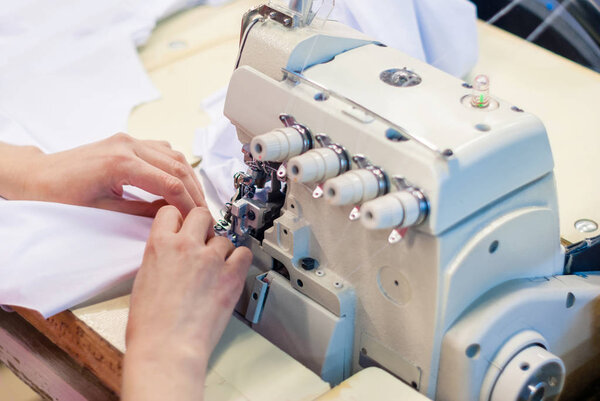 industrial overlock sewing machine in work