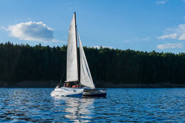 catamaran sailing boat on the background of the shore