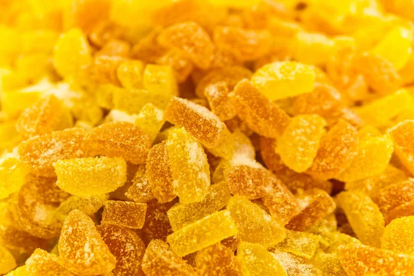 Background - golden yellow translucent gumdrops in sugar — Stock Photo, Image