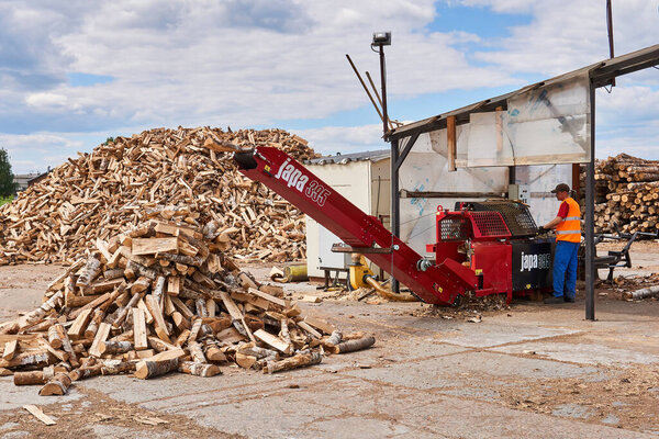 Perm, Russia - May 29, 2020: modern firewood processor in operation