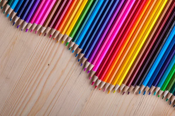 Multicolored Pencils Wave Form Wooden Table Bright Crayons Background Copyspace — Stock Photo, Image